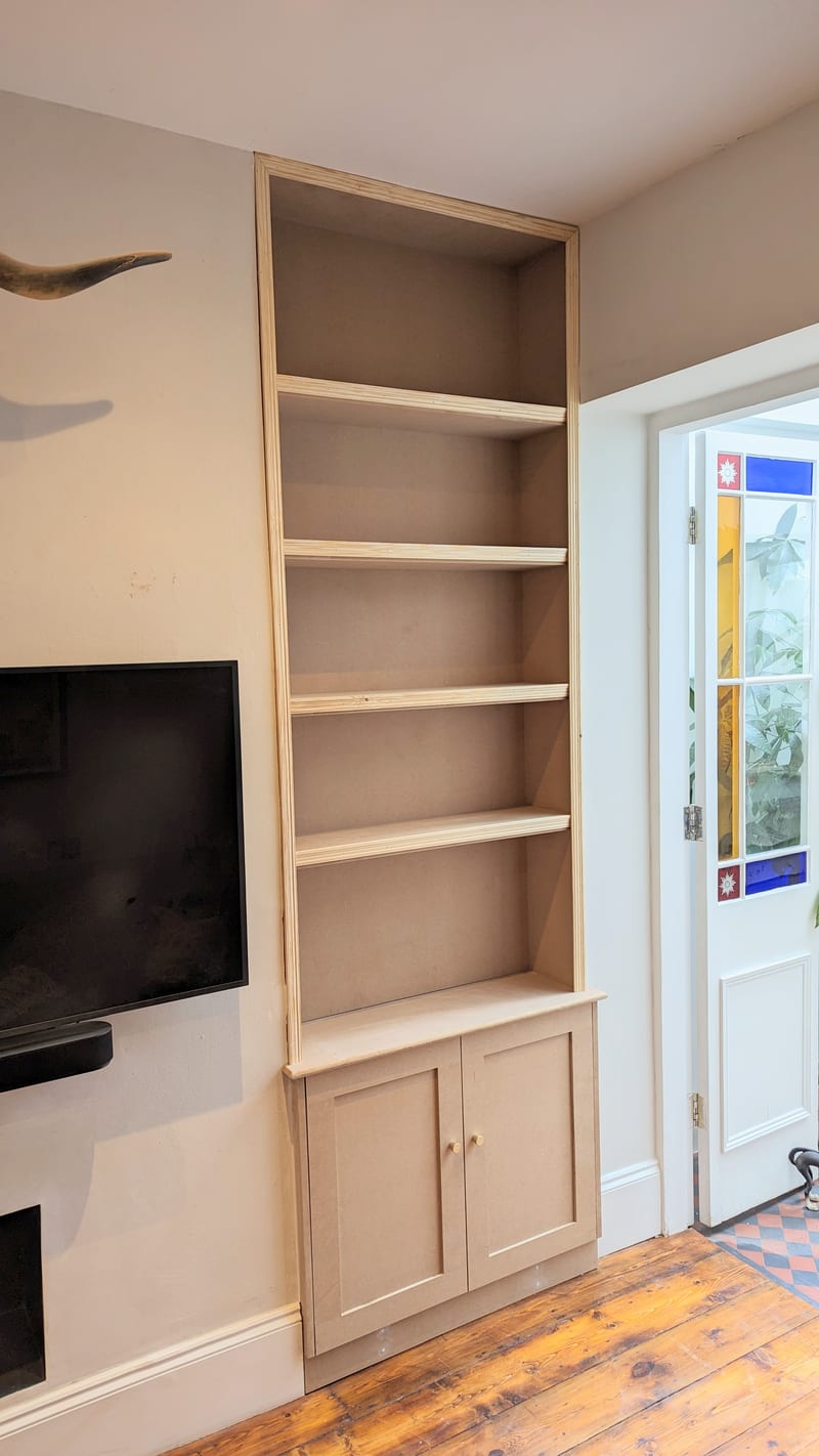 Bespoke alcove cupboard after — fitted shelves over base cabinet