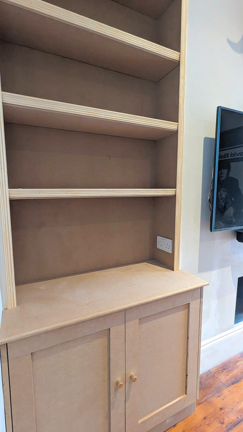 Bespoke alcove cupboard — installed shelving view