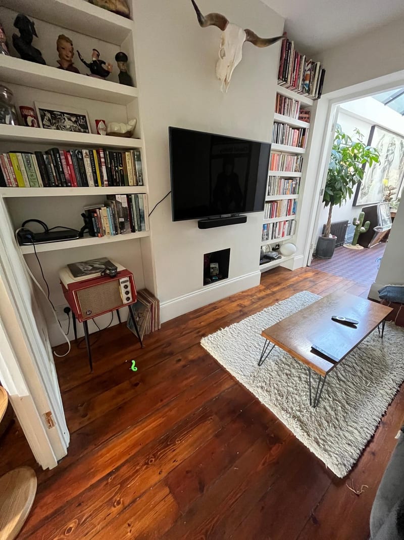 Victorian living room before — dated alcove shelving